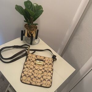Used Coach crossbody purse, cram and brown with long leather strap